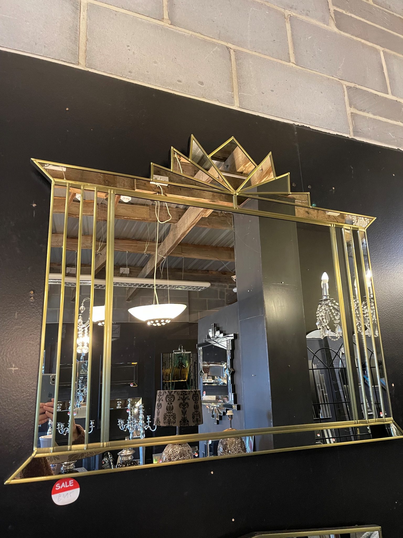 The Hobart Mirror is a stunning Art Deco over-mantle wall mirror, exclusively designed and handcrafted by British mirror artist Phillip Orr in our Norfolk workshop. This luxurious mirror features a bold central panel surrounded by angled mirrored sections and finished with a striking fan-shaped crown – a classic Art Deco statement for elegant interiors.