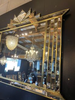 The Hobart Mirror is a stunning Art Deco over-mantle wall mirror, exclusively designed and handcrafted by British mirror artist Phillip Orr in our Norfolk workshop. This luxurious mirror features a bold central panel surrounded by angled mirrored sections and finished with a striking fan-shaped crown – a classic Art Deco statement for elegant interiors.