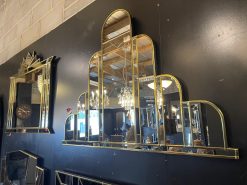 The Turin Handmade Original Art Deco Over Mantle Wall Mirror has been crafted in our Norfolk workshop and is exclusively available from MirrorMania. This stunningly exquisite, art deco mirror which you would call 'wow' but we call Turin, features a total of 14 hand-cut pieces of mirror. The sweeping central domed panel is bordered by clear slightly angled sections of shaped mirro