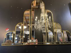 The Turin Handmade Original Art Deco Over Mantle Wall Mirror has been crafted in our Norfolk workshop and is exclusively available from MirrorMania. This stunningly exquisite, art deco mirror which you would call 'wow' but we call Turin, features a total of 14 hand-cut pieces of mirror. The sweeping central domed panel is bordered by clear slightly angled sections of shaped mirro