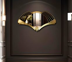 Elise Deco Nouveau Wall Mirror: Handcrafted in Norfolk, England, by mirror artist Phillip Orr. Gold and black glass frame surrounds a central clear mirror. Intricate Art Deco design inspired by 1920s headress, offering a unique blend of elegance and innovation