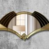 Elise Deco Nouveau Wall Mirror: Handcrafted in Norfolk, England, by mirror artist Phillip Orr. Gold and black glass frame surrounds a central clear mirror. Intricate Art Deco design inspired by 1920s headress, offering a unique blend of elegance and innovation