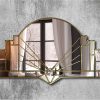 Art Deco-inspired mirror featuring a central curved panel with stepped sections bordered by intricate detailing leading to a focal point at the base. Handcrafted with silver, gold, or black trim options. Handmade in Norfolk workshop