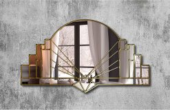 Art Deco-inspired mirror featuring a central curved panel with stepped sections bordered by intricate detailing leading to a focal point at the base. Handcrafted with silver, gold, or black trim options. Handmade in Norfolk workshop